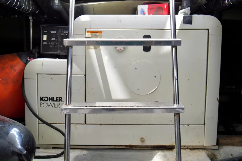 Slide: The Image of Kohler power system in 1999 Carver 450 Voyager Pilothouse engine room. - 65