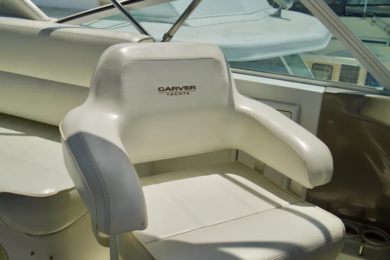 Slide: The Image of White captain's chair on 1999 Carver 450 Voyager Pilothouse yacht. - 78