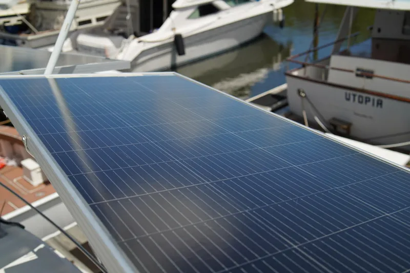 Slide: The Image of Solar panel on a 1999 Carver 450 Voyager Pilothouse yacht, docked at a marina. - 83