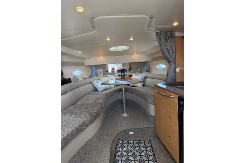 Slide: The Image of Interior of 2004 Maxum 3100 SE boat with cozy seating and modern amenities. - 4