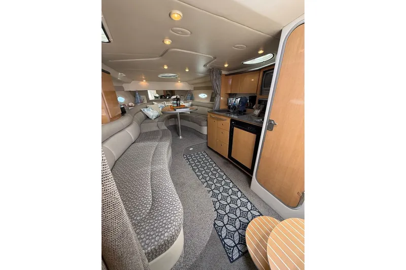 Slide: The Image of Interior of 2004 Maxum 3100 SE boat with cozy seating and kitchenette. - 6