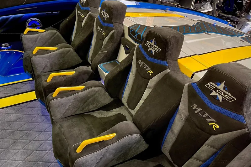 Slide: The Image of Interior of a 2022 DCB M37 boat with custom seating and vibrant accents. - 11