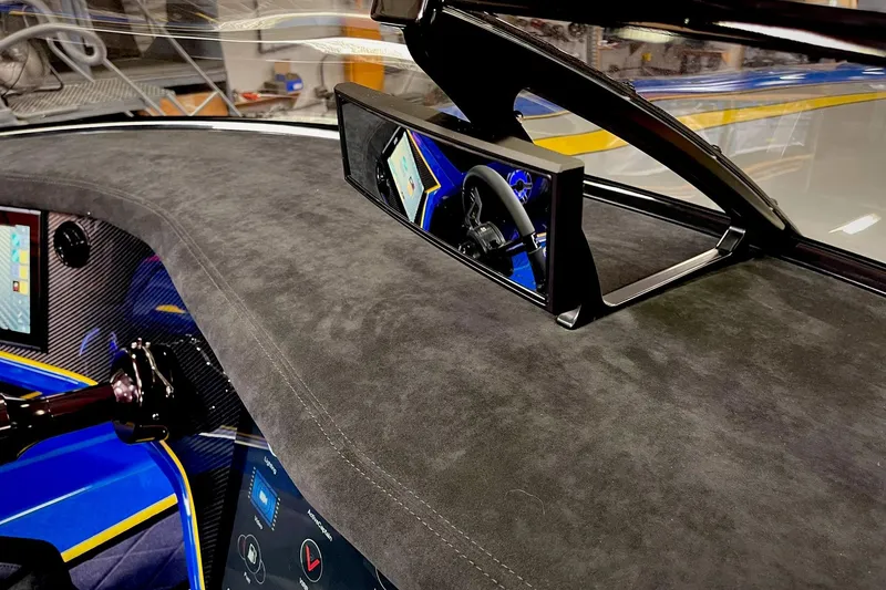 Slide: The Image of Interior of 2022 DCB M37 boat featuring modern dashboard and steering wheel. - 16