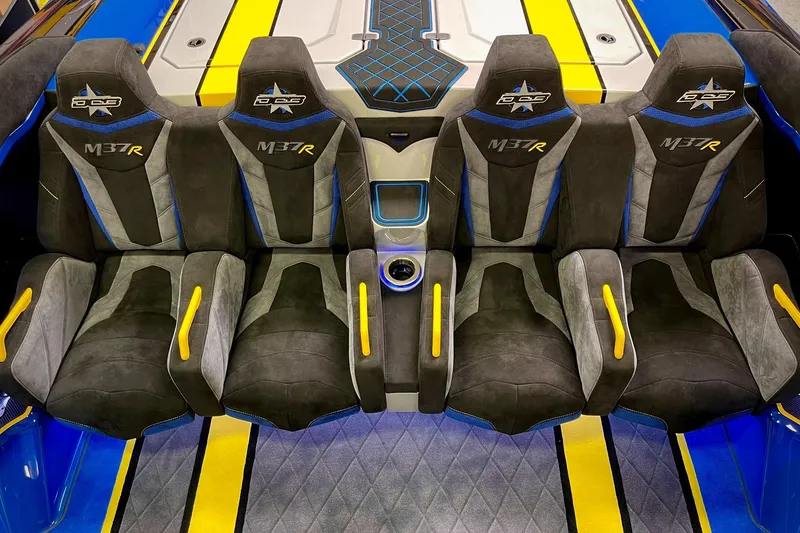Slide: The Image of Interior of 2022 DCB M37 boat with stylish seats and vibrant accents. - 24