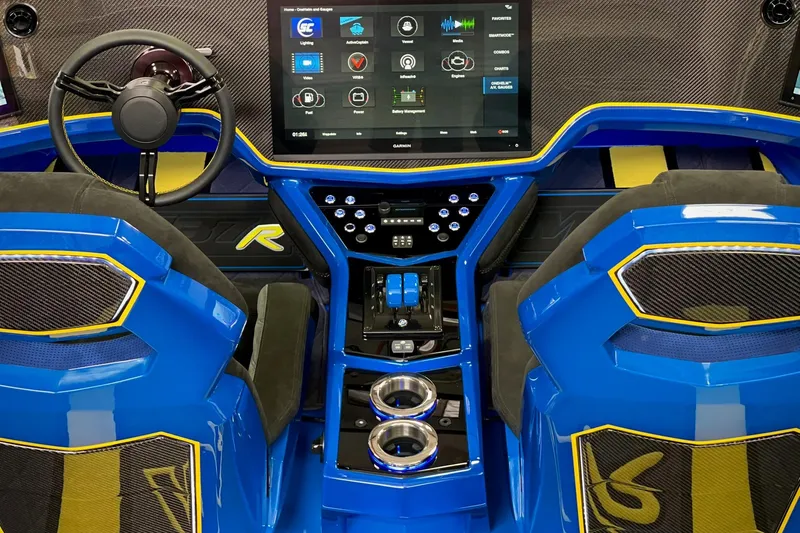 Slide: The Image of Interior of a 2022 DCB M37 boat with blue seats and advanced dashboard technology. - 4