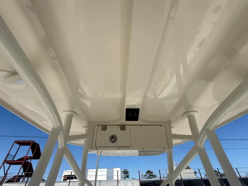 Slide: The Image of 2023 Sailfish 220 CC boat underside view with clear blue sky background. - 17