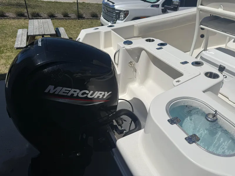 Slide: The Image of 2023 Sailfish 220 CC boat with Mercury outboard motor and livewell. - 22