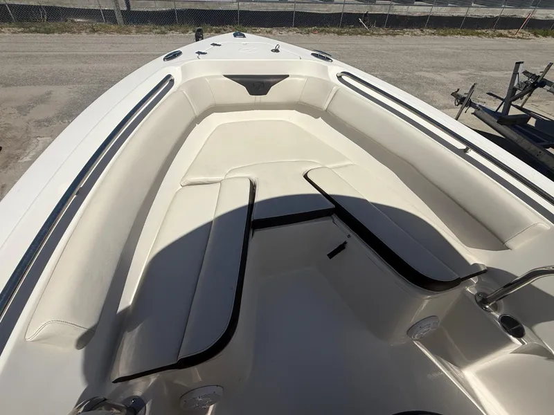 Slide: The Image of 2023 Sailfish 220 CC boat interior with cushioned seating and sleek design. - 35