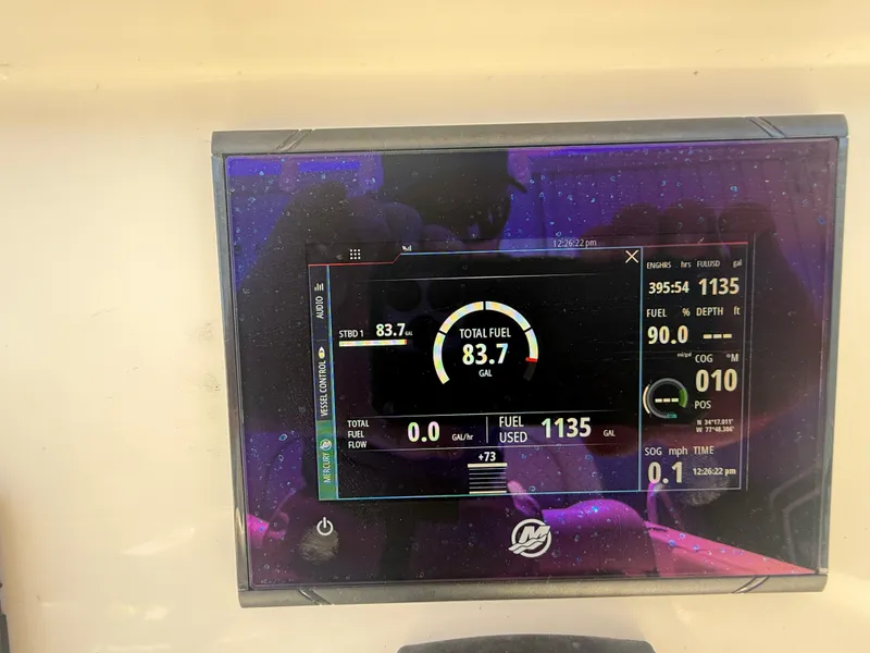 Slide: The Image of Dashboard display of a 2023 Sailfish 220 CC showing fuel and navigation data. - 38