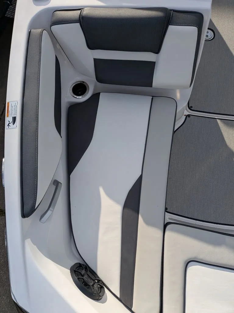Slide: The Image of Interior of 2023 Yamaha SX195 boat with gray and white upholstery. - 12