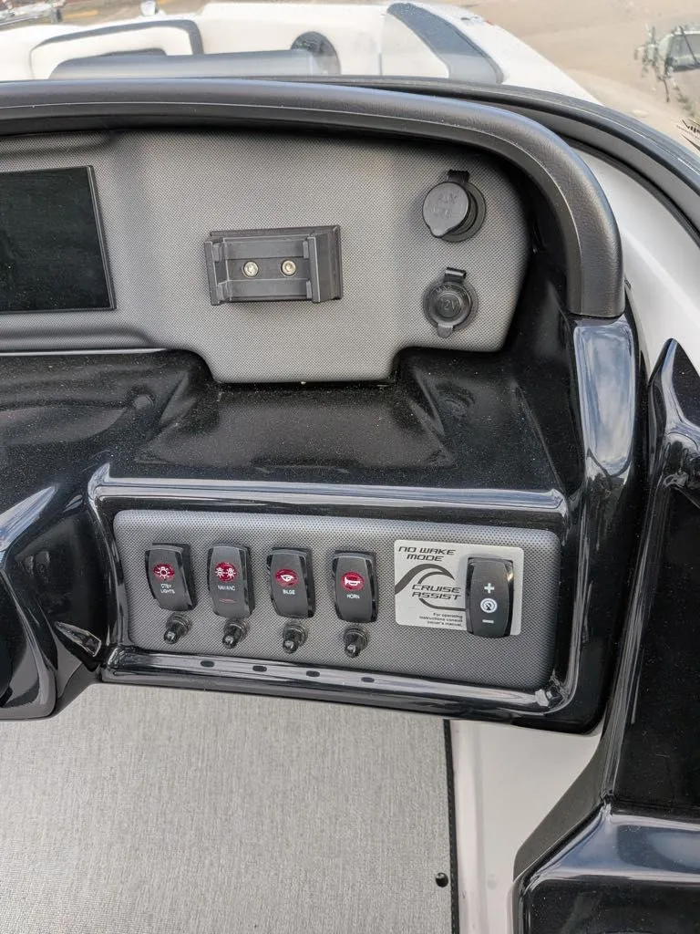 Slide: The Image of Dashboard of 2023 Yamaha SX195 boat with switches and controls. - 17