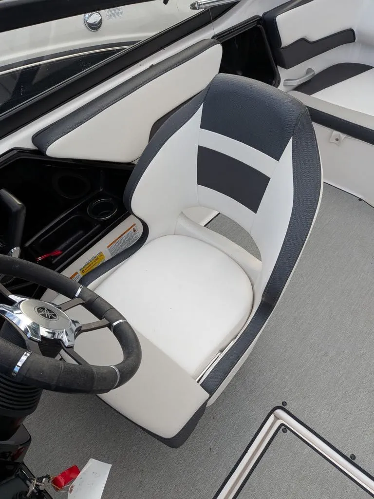 Slide: The Image of Interior of 2023 Yamaha SX195 boat with steering wheel and seat. - 3