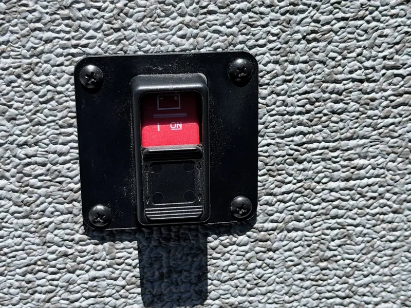 Slide: The Image of Close-up of a switch on a 2026 Starcraft Fishmaster 196. - 46