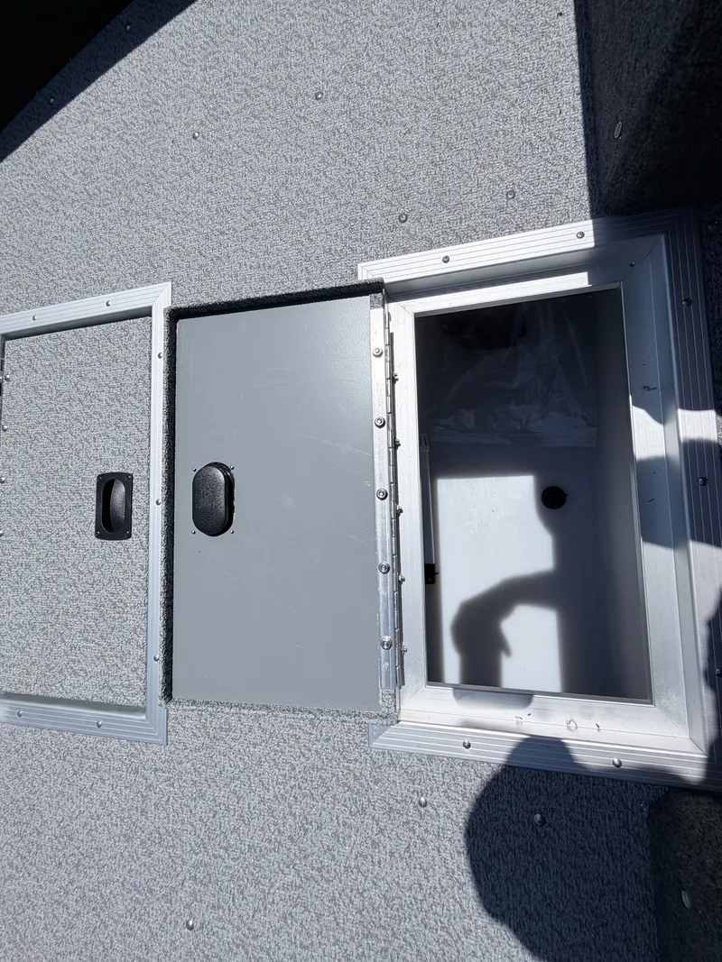 Slide: The Image of Starcraft Fishmaster 196 2026 boat hatch with storage compartment. - 47