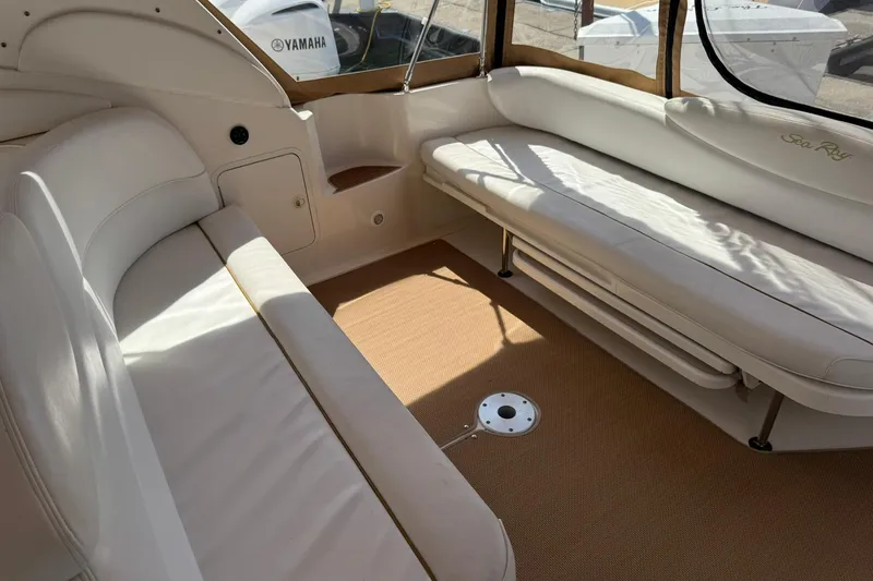 Slide: The Image of Interior of 2001 Sea Ray 340 Sundancer boat with beige seating and carpet. - 14