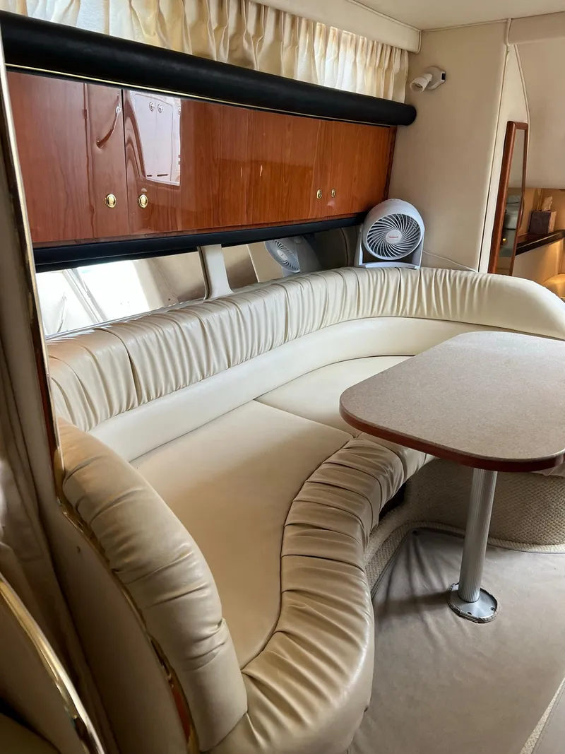 Slide: The Image of Interior of 2001 Sea Ray 340 Sundancer with leather seating area. - 16