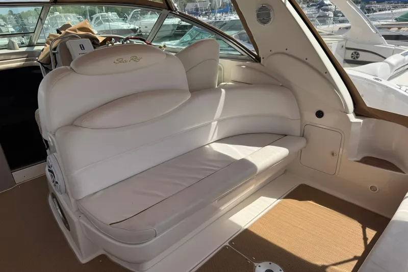 Slide: The Image of Interior of a 2001 Sea Ray 340 Sundancer boat with white leather seating. - 17