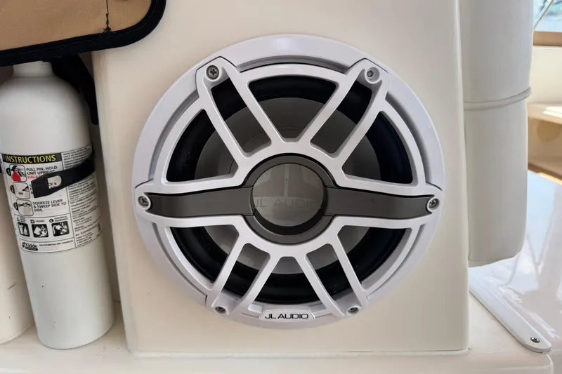 Slide: The Image of JL Audio speaker on 2001 Sea Ray 340 Sundancer boat, next to a fire extinguisher. - 18
