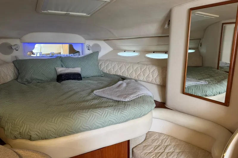 Slide: The Image of Luxurious cabin interior of a 2001 Sea Ray 340 Sundancer yacht with cozy bedding. - 23