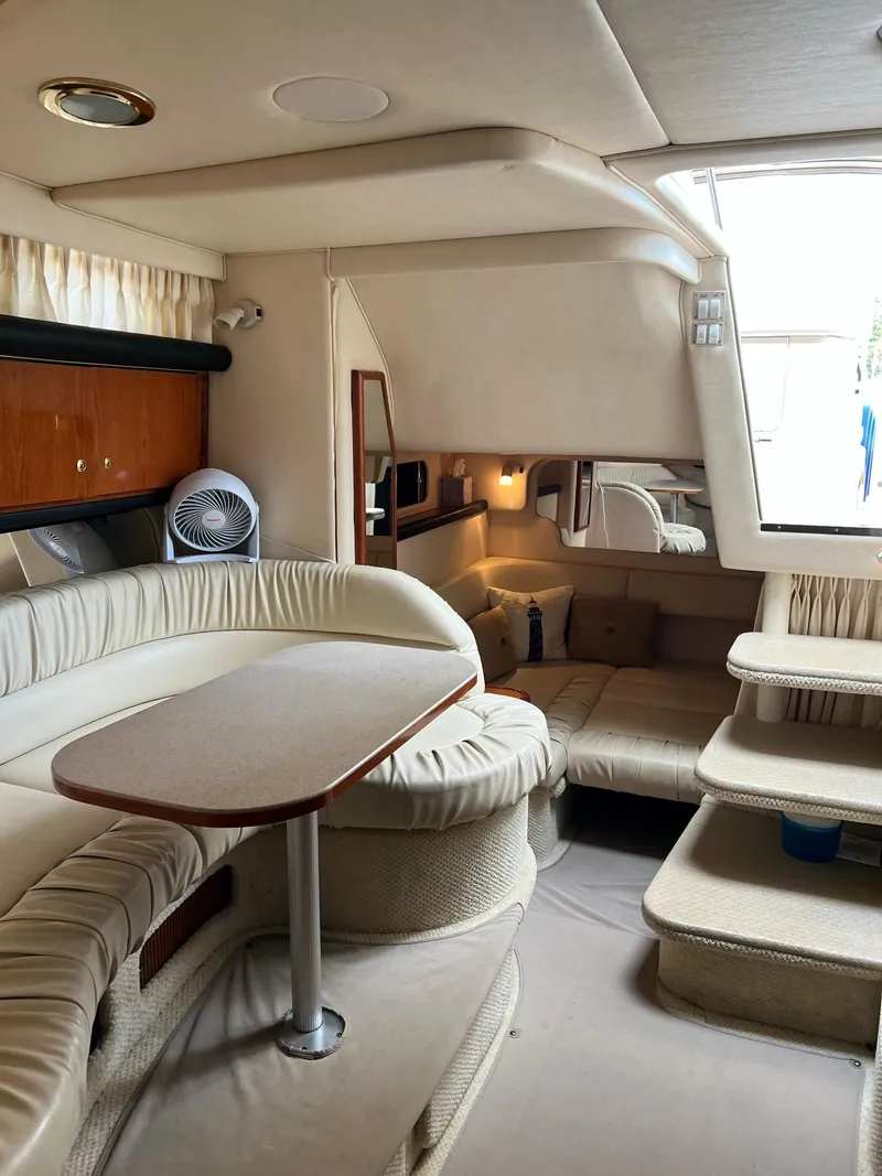 Slide: The Image of Interior of a 2001 Sea Ray 340 Sundancer yacht with elegant furnishings. - 25