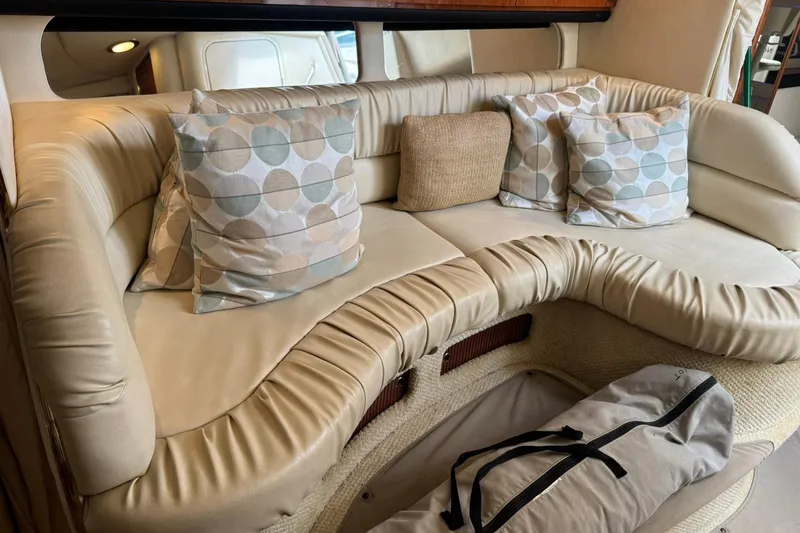 Slide: The Image of Luxurious interior seating of 2001 Sea Ray 340 Sundancer with decorative pillows. - 26