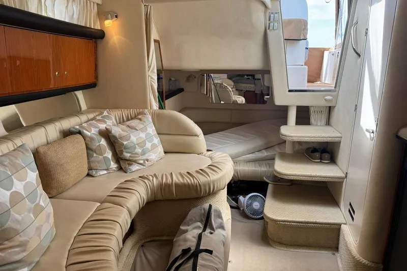 Slide: The Image of Interior of 2001 Sea Ray 340 Sundancer yacht with cozy seating and elegant decor. - 27