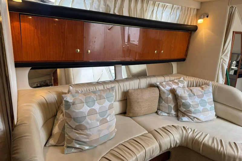 Slide: The Image of Luxurious interior of 2001 Sea Ray 340 Sundancer with plush seating and decorative pillows. - 29