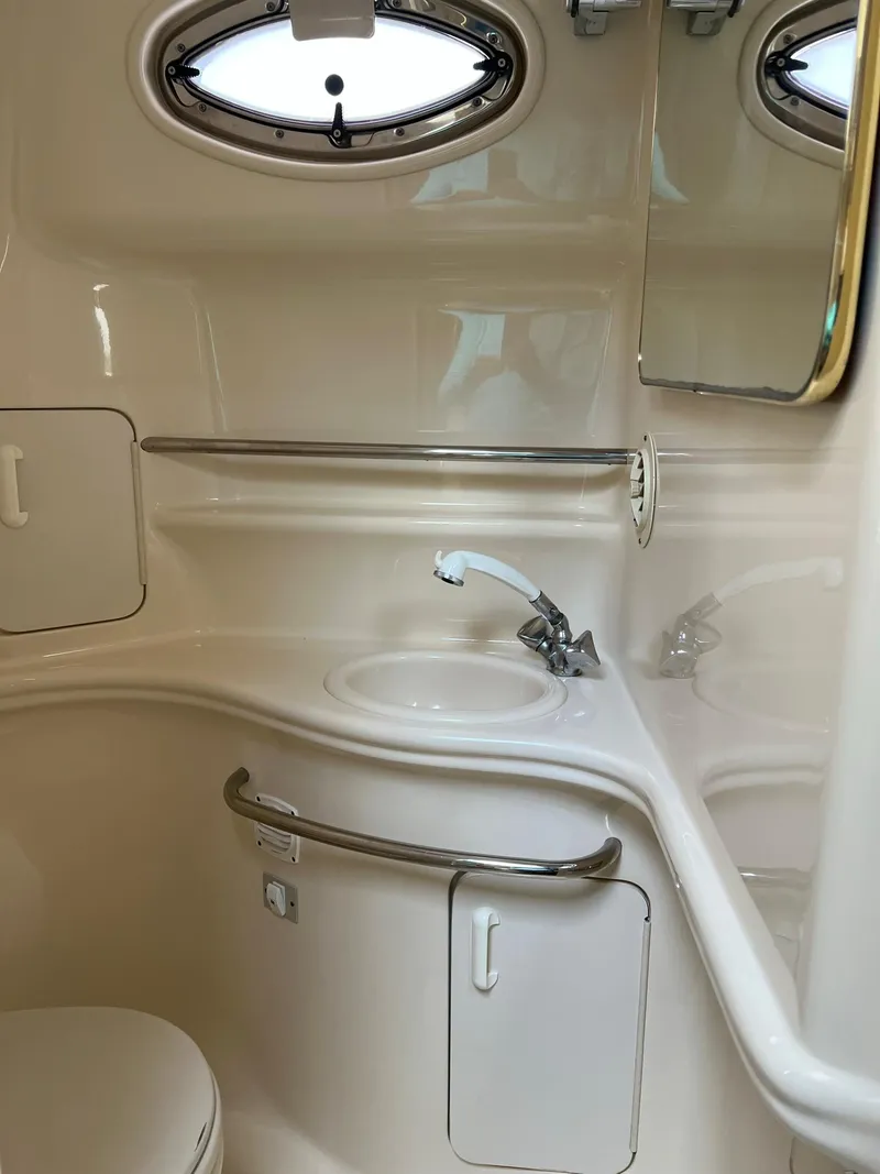 Slide: The Image of Interior of 2001 Sea Ray 340 Sundancer with sink and mirror. - 36