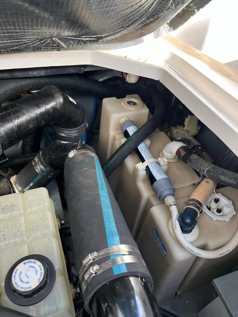 Slide: The Image of Engine compartment of 2001 Sea Ray 340 Sundancer with hoses and tanks. - 39
