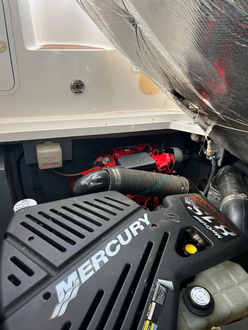 Slide: The Image of Engine compartment of a 2001 Sea Ray 340 Sundancer with Mercury engine. - 40