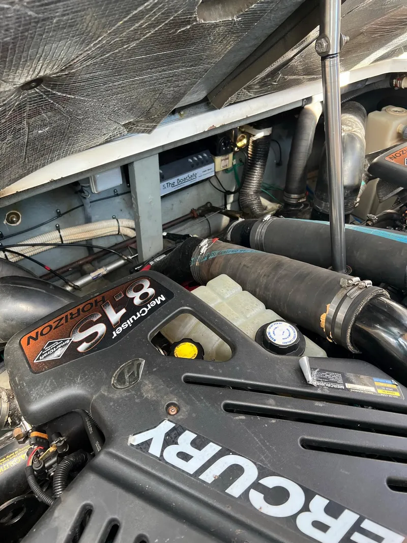 Slide: The Image of Engine compartment of a 2001 Sea Ray 340 Sundancer with Mercury engine. - 41