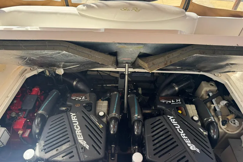 Slide: The Image of Engine compartment of a 2001 Sea Ray 340 Sundancer with Mercury engines. - 43