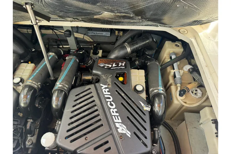 Slide: The Image of Engine compartment of a 2001 Sea Ray 340 Sundancer with Mercury components. - 44