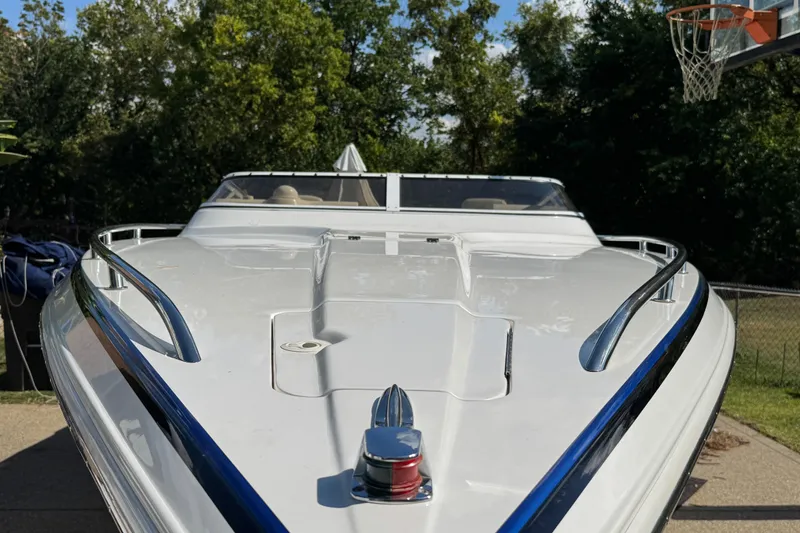 Slide: The Image of 2004 Fountain 27 Fever boat with sleek white design and chrome accents. - 12