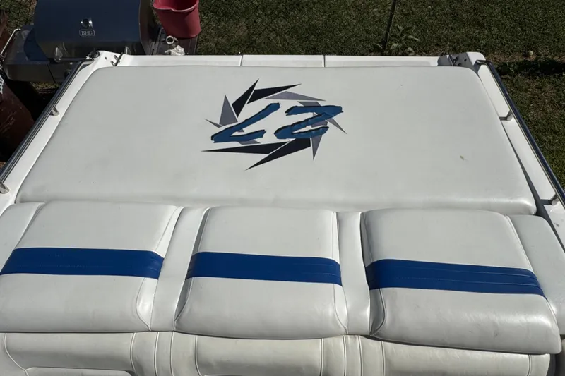 Slide: The Image of 2004 Fountain 27 Fever boat seat with blue accents and logo design. - 13