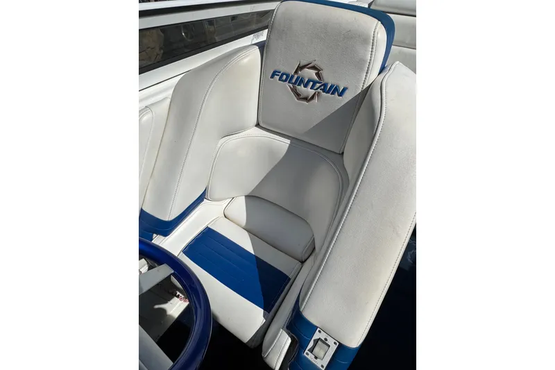 Slide: The Image of White and blue seating in 2004 Fountain 27 Fever boat. - 22