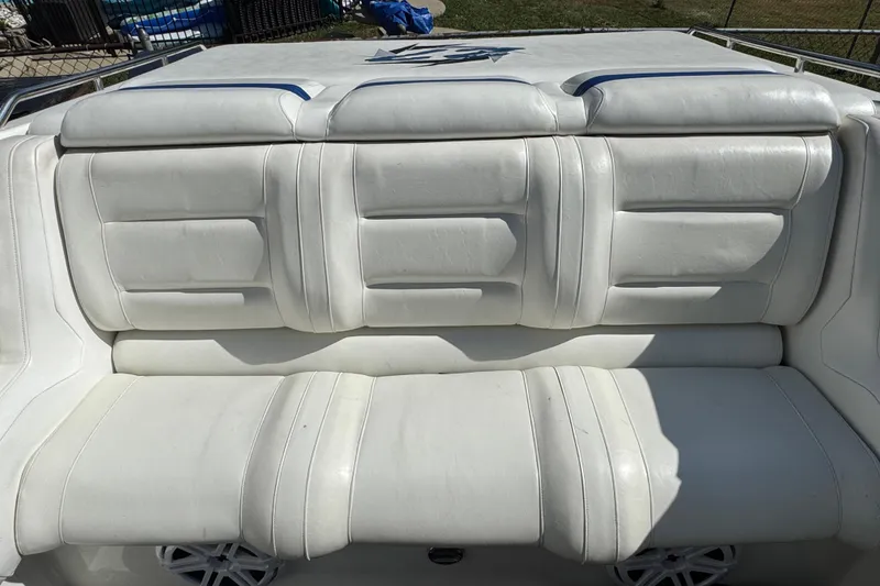 Slide: The Image of 2004 Fountain 27 Fever boat interior with white cushioned seating. - 24