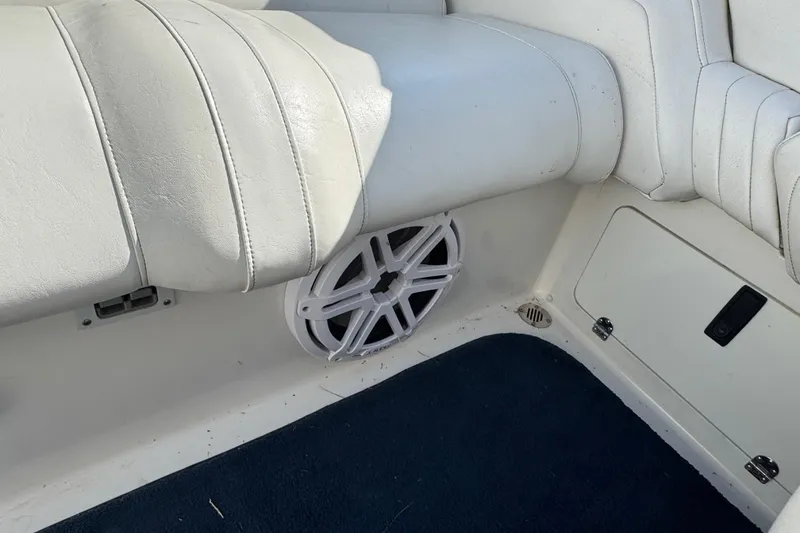 Slide: The Image of Interior of 2004 Fountain 27 Fever boat with white seating and speaker. - 26