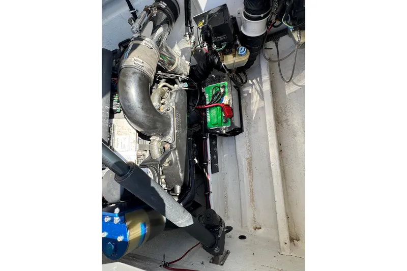Slide: The Image of Engine compartment of a 2004 Fountain 27 Fever boat, showcasing mechanical components. - 31