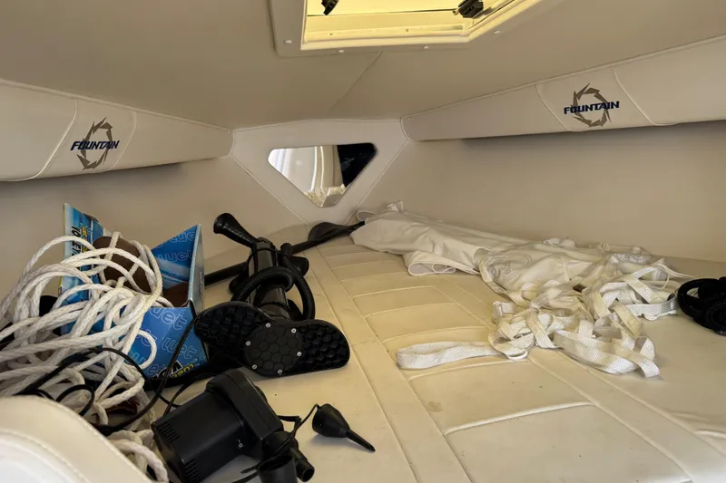 Slide: The Image of Interior of a 2004 Fountain 27 Fever boat with ropes and equipment. - 35