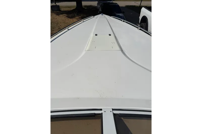 Slide: The Image of 2004 Fountain 27 Fever boat deck, white surface, viewed from above. - 38