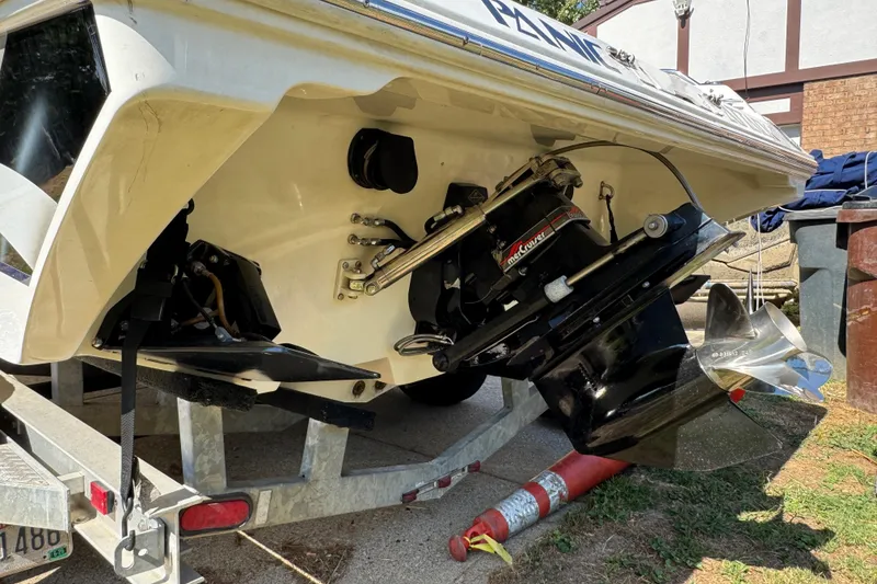 Slide: The Image of Rear view of a 2004 Fountain 27 Fever boat on a trailer, showcasing the propeller and drive system. - 8