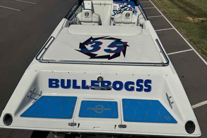 Slide: The Image of 2004 Fountain 35 Lightning speedboat with custom graphics and "BULLDOGSS" text on the deck. - 11