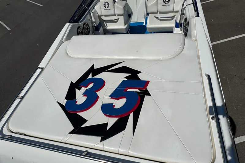Slide: The Image of 2004 Fountain 35 Lightning boat interior with bold "35" design on white upholstery. - 12