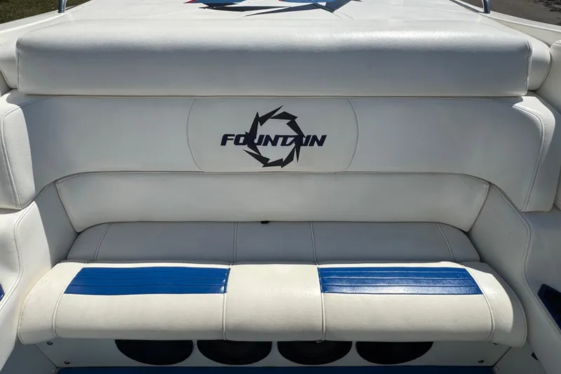Slide: The Image of 2004 Fountain 35 Lightning boat interior with white and blue seating. - 14