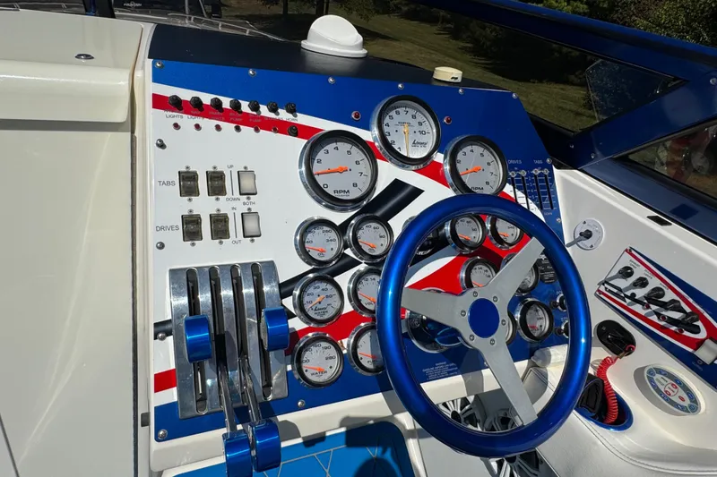 Slide: The Image of Dashboard of a 2004 Fountain 35 Lightning boat with gauges and controls. - 15