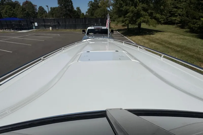Slide: The Image of 2004 Fountain 35 Lightning boat on trailer in parking lot, sunny day. - 18