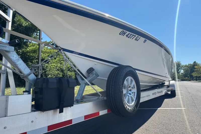 Slide: The Image of 2004 Fountain 35 Lightning boat on trailer in sunny parking lot. - 3