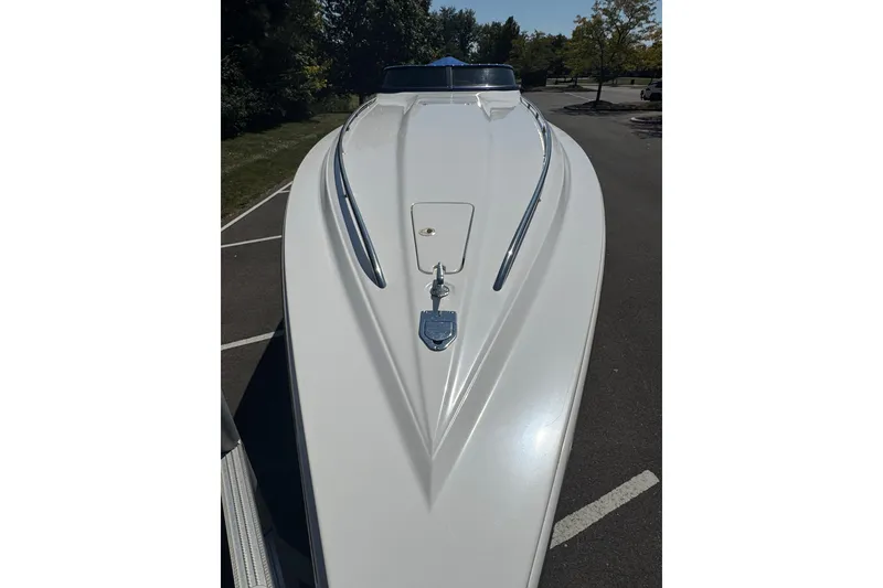 Slide: The Image of 2004 Fountain 35 Lightning boat, sleek white hull, parked outdoors. - 5