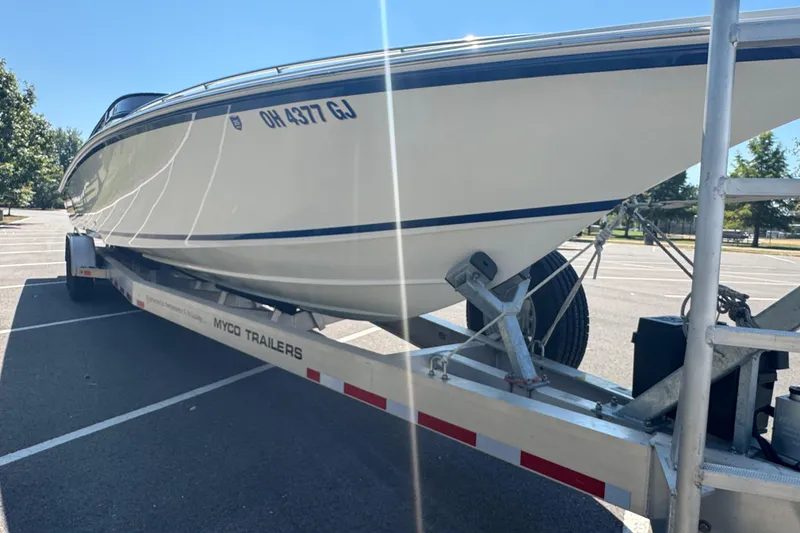 Slide: The Image of 2004 Fountain 35 Lightning boat on Myco trailer in parking lot. - 6